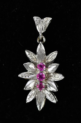 Lot 179 - A white metal clasp set with three pale pink...