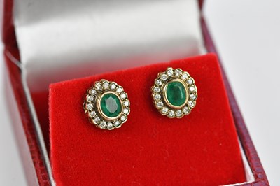 Lot 265 - A pair of yellow metal ear studs set with...