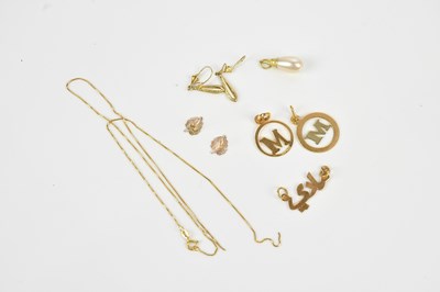 Lot 413 - A yellow metal Arabic name pendant, length...