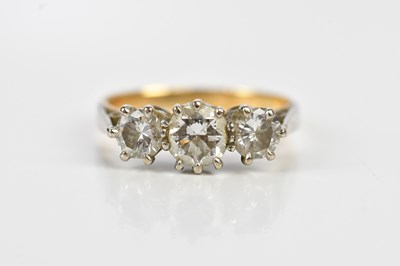 Lot 490 - A yellow and white metal diamond three stone...