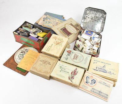 Lot 1667 - A collection of cigarette cards, in albums and...