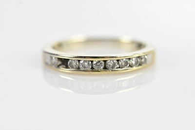 Lot 587 - An 18ct white gold and diamond half eternity...