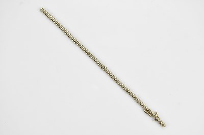 Lot 133 - A 9ct yellow gold fancy bracelet set with...