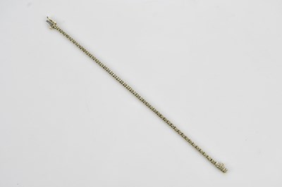 Lot 141 - A 9ct yellow gold bracelet set with small...