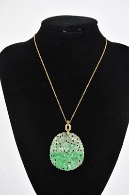 Lot 356 - A Chinese carved jade pendant decorated in the...