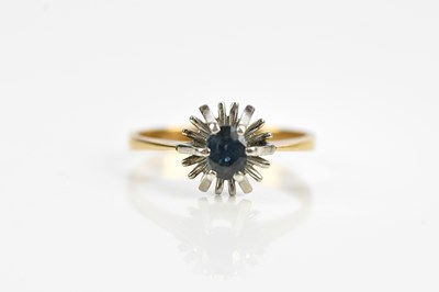 Lot 577 - A yellow and white metal dress ring set with a...