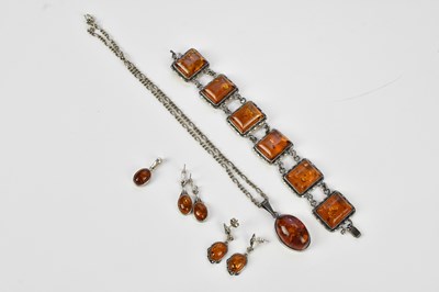 Lot 755 - A selection of baltic amber jewellery set in...
