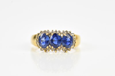 Lot 483 - A yellow metal diamond and sapphire dress ring...