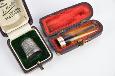 Lot 43 - An amber effect cheroot holder with 9ct gold...