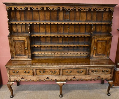 Lot 1657 - An 18th century style Shropshire design oak...