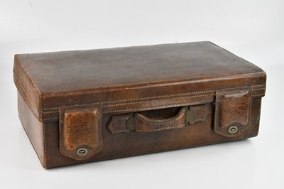 Lot 2222 - An early 20th century leather suitcase, length...