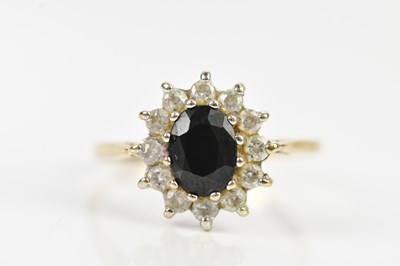 Lot 689 - A 9ct yellow gold cluster dress ring, set with...