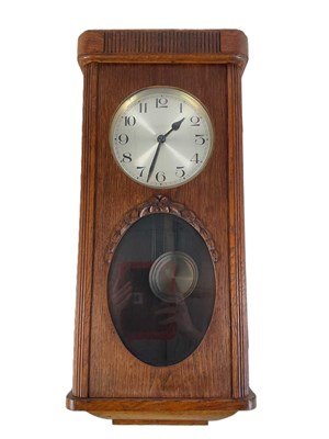 Lot 209 - A modern oak cased wall clock, 76 x 34 x 18cm.