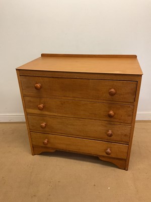 Lot 686 - A stained pine chest of four long drawers,...