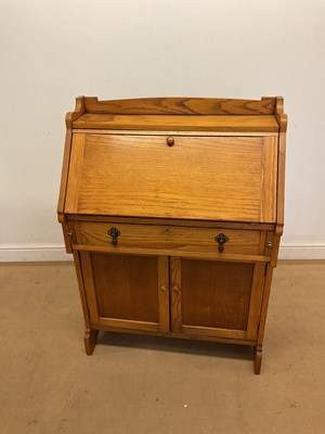 Lot 781 - A light oak bureau, the fall front enclosing a...