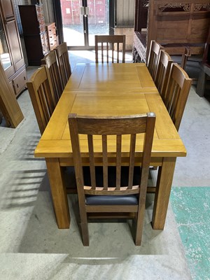Lot 671 - An extending modern oak table, unextended...