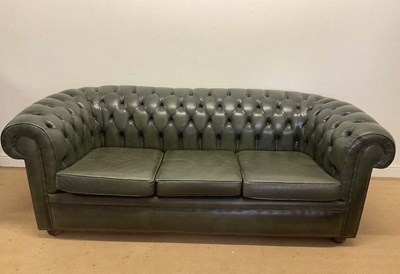 Lot 666 - A green leather button back Chesterfield sofa,...