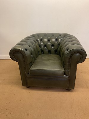 Lot 677 - A green leather button back tub chair, height...