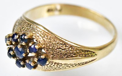 Lot 748 - A 9ct yellow gold ring set with nine sapphires...