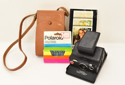 Lot 385 - POLAROID; a model SX-70 land camera, with case,...
