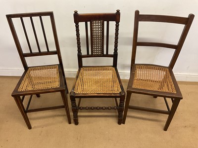 Lot 690 - Two oak and rattan chairs and a mahogany...