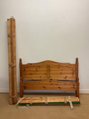 Lot 707 - A regular double size pine bed, height 190cm,...