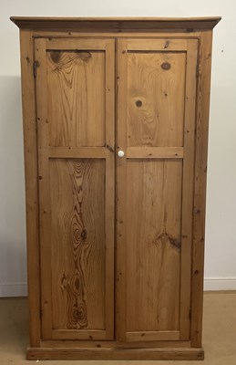 Lot 759 - A pine two door wardrobe/cupboard, with four...
