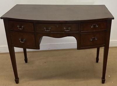 Lot 680 - A mahogany bowfronted desk with central drawer,...