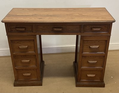 Lot 681 - A pine pedestal desk, the top with a central...