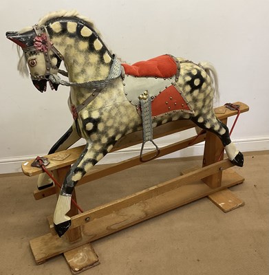 Lot 111 - A dapple grey rocking horse, height 118cm