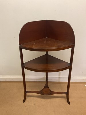 Lot 775 - A two tier mahogany corner washstand, raised...