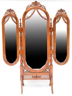 Lot 73 - A reproduction carved walnut triptych cheval...