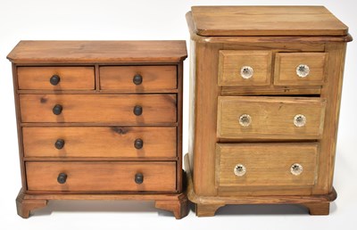 Lot 234 - Two pine tabletop apprentice chests of drawers,...