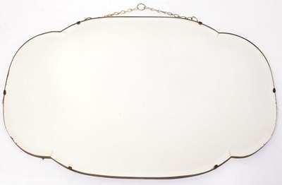 Lot 68 - A 1940s wall mirror of shaped form with...