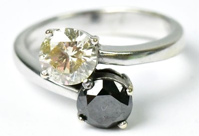 Lot 720 - An 18ct white gold ring set with a white...