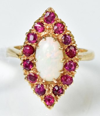 Lot 716 - An 18ct yellow gold ring set with an opal...