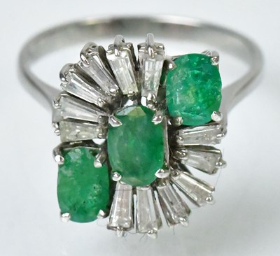 Lot 721 - An 18ct white gold ring set with three oval...