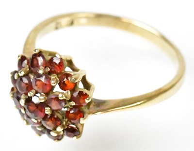 Lot 754 - A 9ct yellow gold garnet set floral cluster...