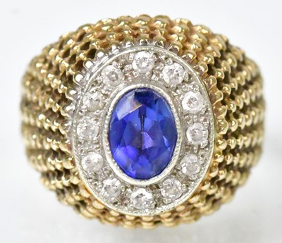 Lot 749 - A 9ct yellow gold ring set with a central oval...