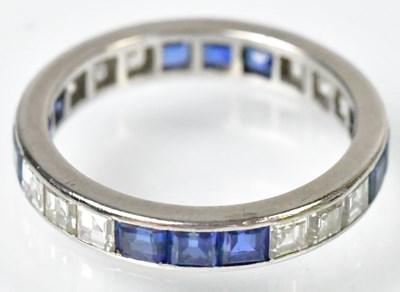 Lot 764 - A white metal diamond and sapphire eternity...