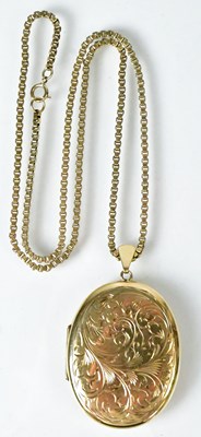 Lot 795 - A large 9ct yellow gold oval locket with...