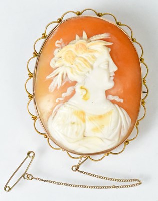 Lot 787 - A large oval shell cameo depicting a woman...