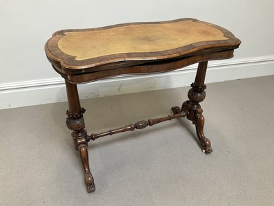 Lot 1083 - A Victorian walnut serpentine card table, with...