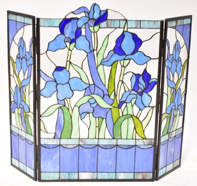 Lot 76 - A stained leaded glass folding firescreen...