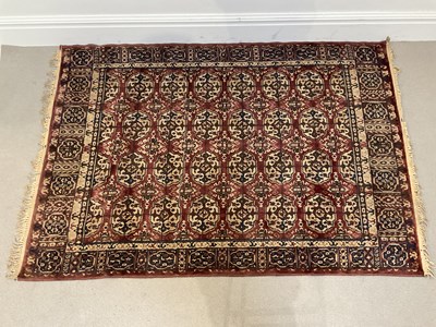 Lot 1414 - A decorative Eastern rug with stylised motifs...