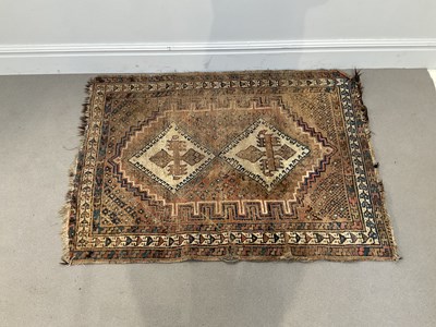 Lot 298 - An Eastern rug with stylised lozenge detail on...
