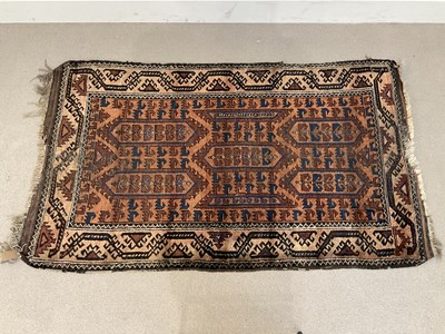 Lot 300 - An early 20th century Afgan rug with stylised...