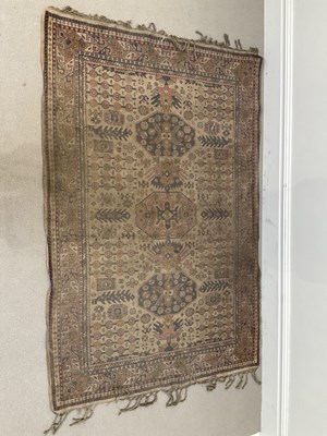Lot 1404 - A large Eastern rug decorated with stylised...