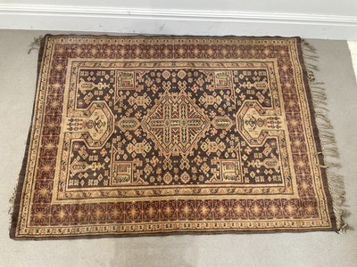 Lot 1401 - An Eastern rug, decorated with stylised detail...
