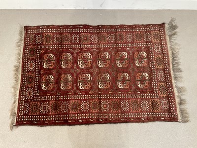 Lot 1402 - A Bokara rug with elephant foot decoration on...